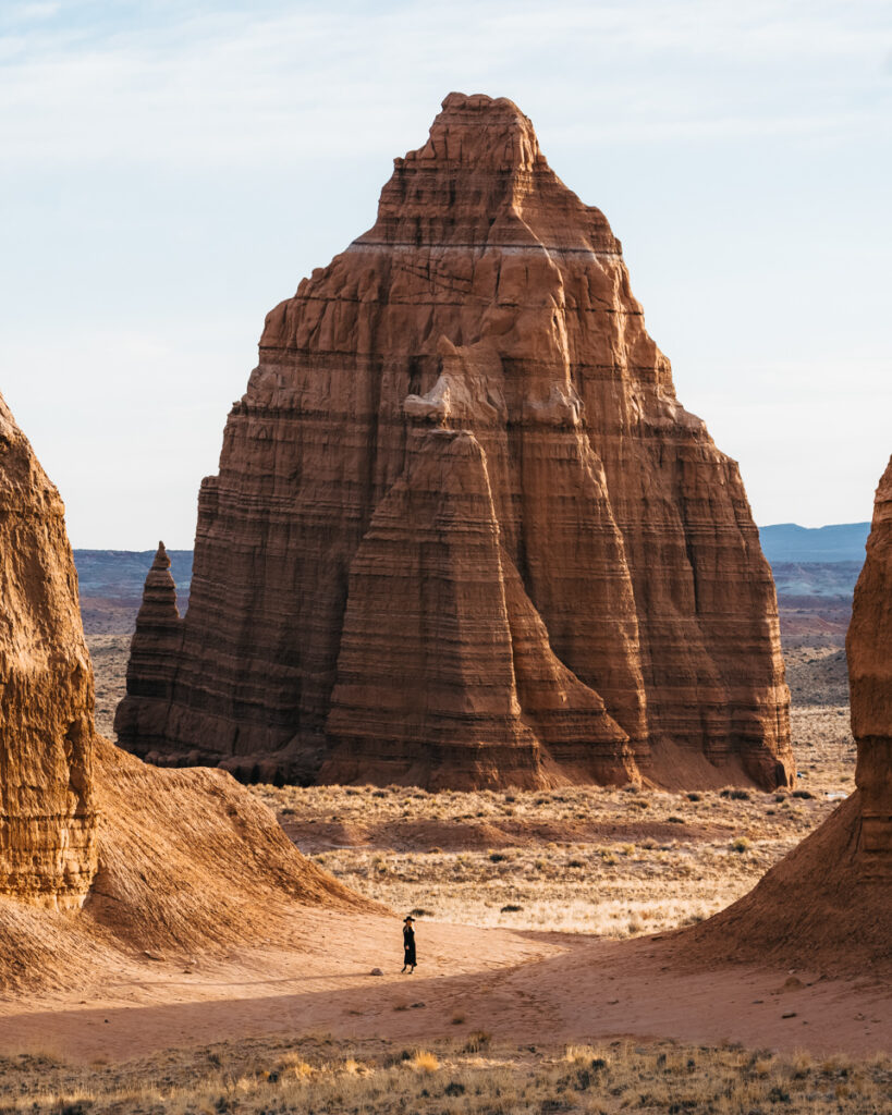 Hanksville Utah remains an extremely underrated Utah Road Trip destination. Explore slot canyons and see wild landscapes that look like Mars. Factory Butte, Bentonite Hills, Leprechaun canyon, temple of the sun