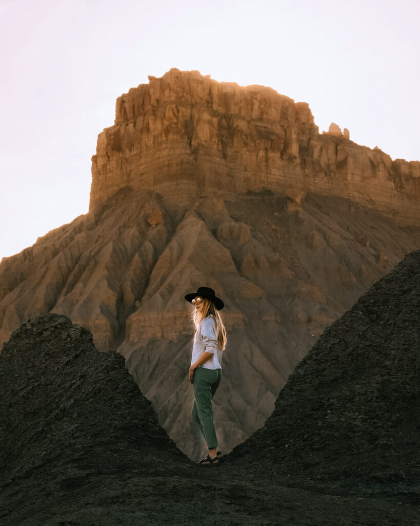 Hanksville Utah remains an extremely underrated Utah Road Trip destination. Explore slot canyons and see wild landscapes that look like Mars. Factory Butte, Bentonite Hills, Leprechaun canyon, temple of the sun